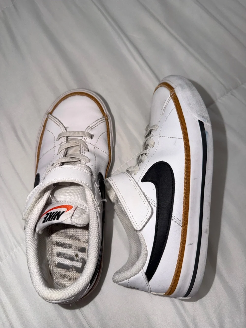 Nike White Kids Sneakers with Black Swoosh and Brown Trim